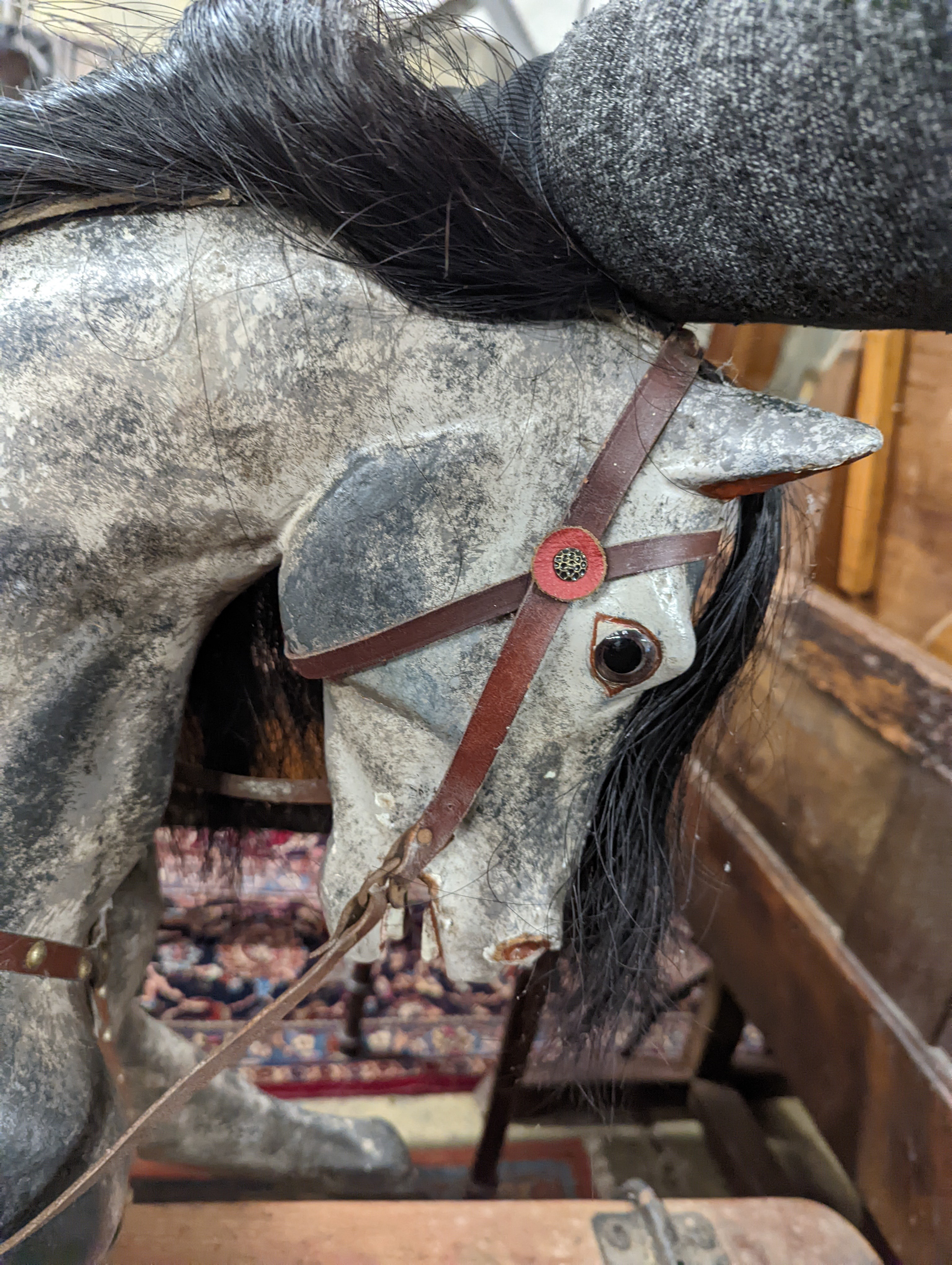 A large Edwardian Ayres type rocking horse on a turned safety frame, length 160cm, height 110cm